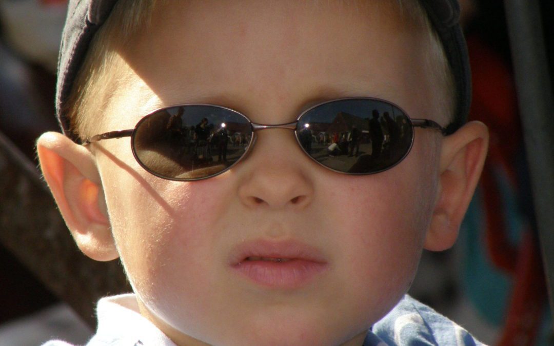 kid wearing sunglasses during UV safety awareness month